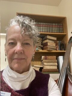 Photo of administrative co-director Janet Rhodes, a white woman in her 60's with curly hair